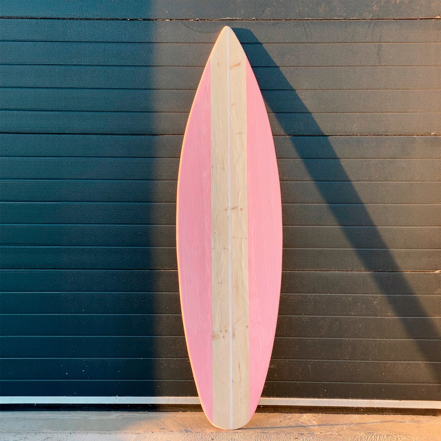 Wooden decorative surfboard in baby pink with handcrafted details