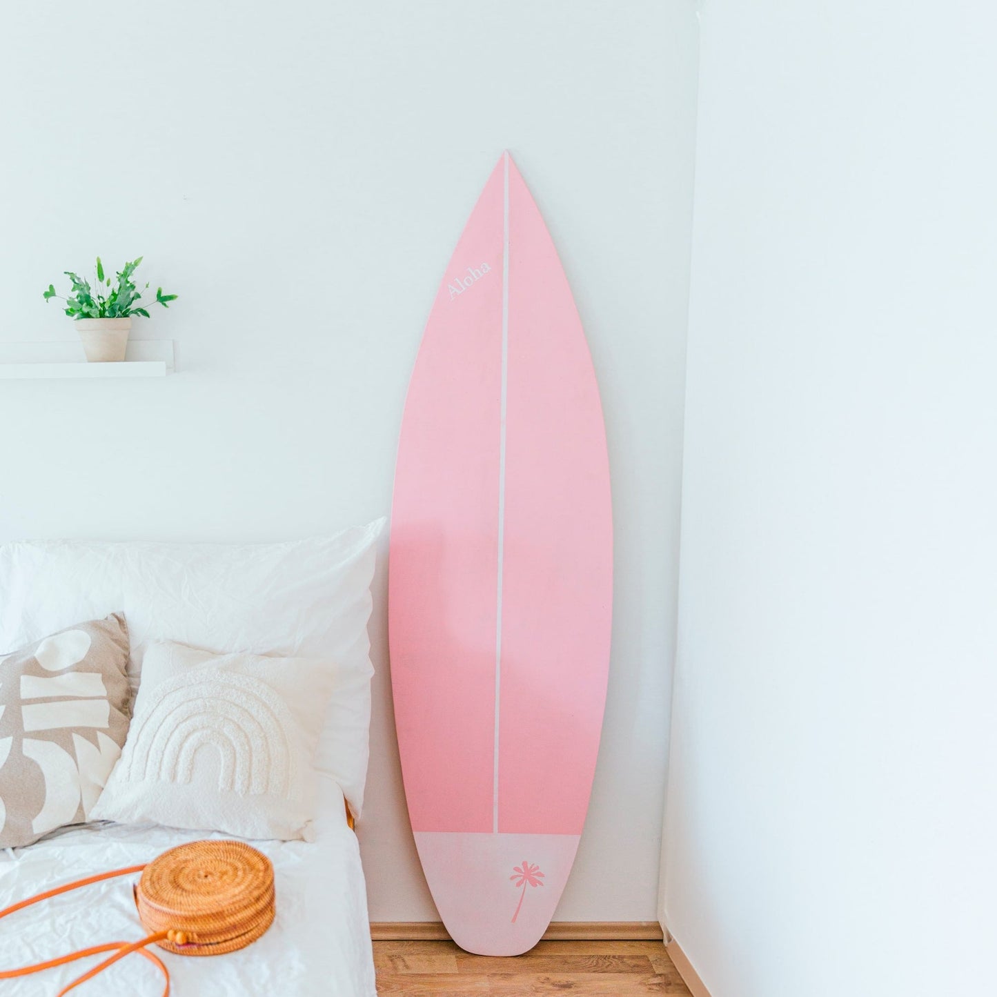 Wooden decorative surfboard in baby pink with handcrafted details for bedroom coastal wall art decor