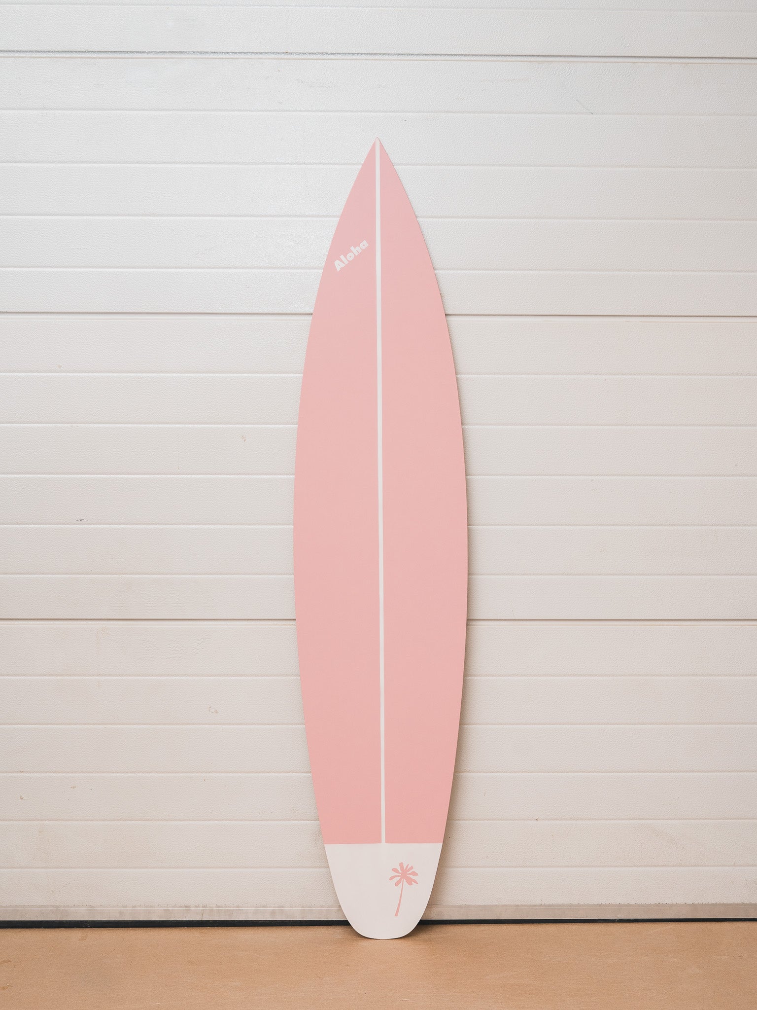 Baby pink wooden surfboard wall art. Perfect as coastal home decor, nautical wall accent, or beach house decoration. This decorative wooden surfboard is a retro-style wall hanging that brings tropical surf vibes to any living room, patio, or surf shack. A unique gift for surfers, ocean lovers, or coastal interior design enthusiasts, adding charm and style to indoor and outdoor spaces.