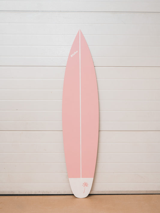 Baby pink wooden surfboard wall art. Perfect as coastal home decor, nautical wall accent, or beach house decoration. This decorative wooden surfboard is a retro-style wall hanging that brings tropical surf vibes to any living room, patio, or surf shack. A unique gift for surfers, ocean lovers, or coastal interior design enthusiasts, adding charm and style to indoor and outdoor spaces.