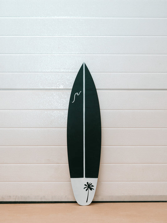 Black and white surfboard with palm tree and customisable wave design.