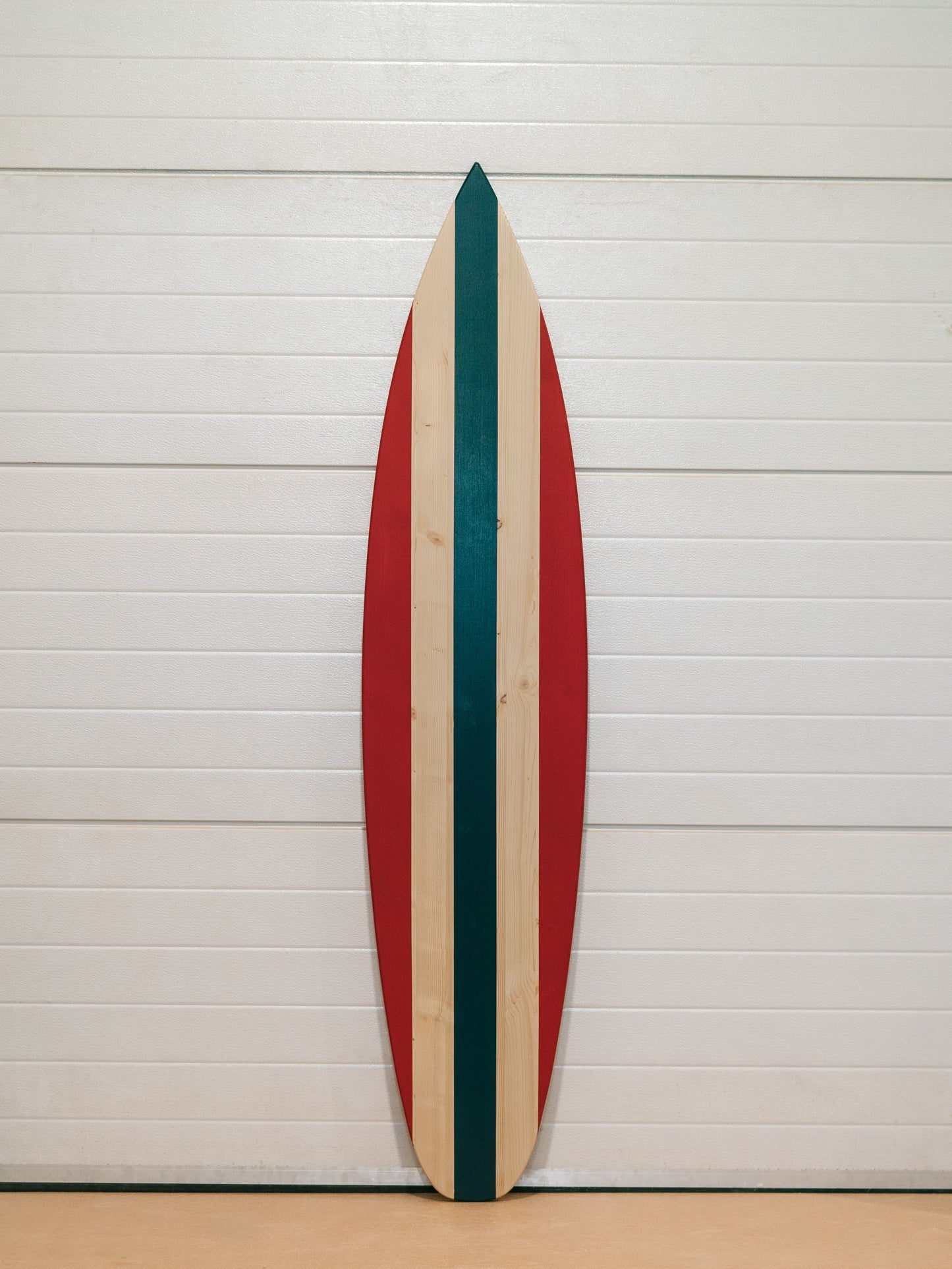 Large vintage wooden surfboard with custom painted middle stripe — eco friendly wall art for surf culture lovers.