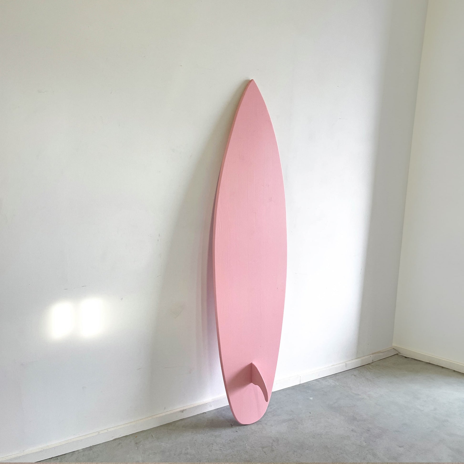 pale pink wooden decorative surfboard wall art