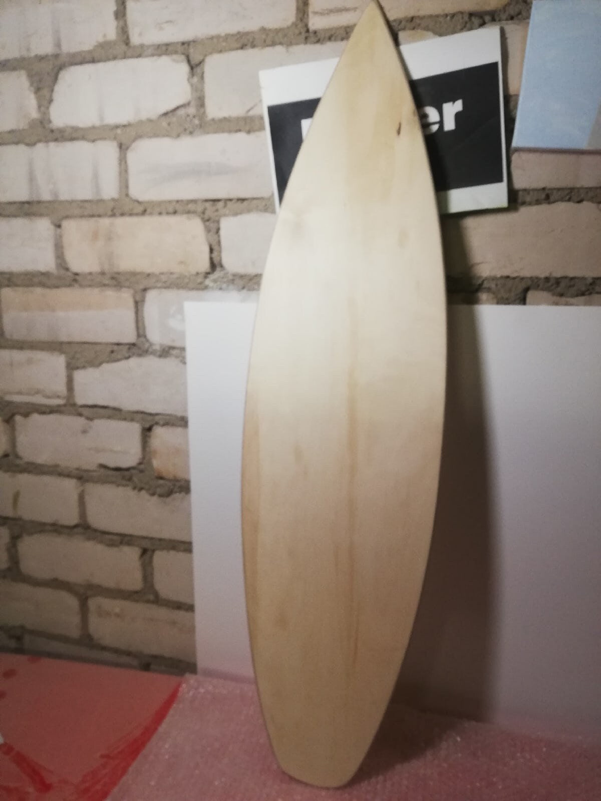 Unpainted wooden surfboard, your DIY canvas for creativity