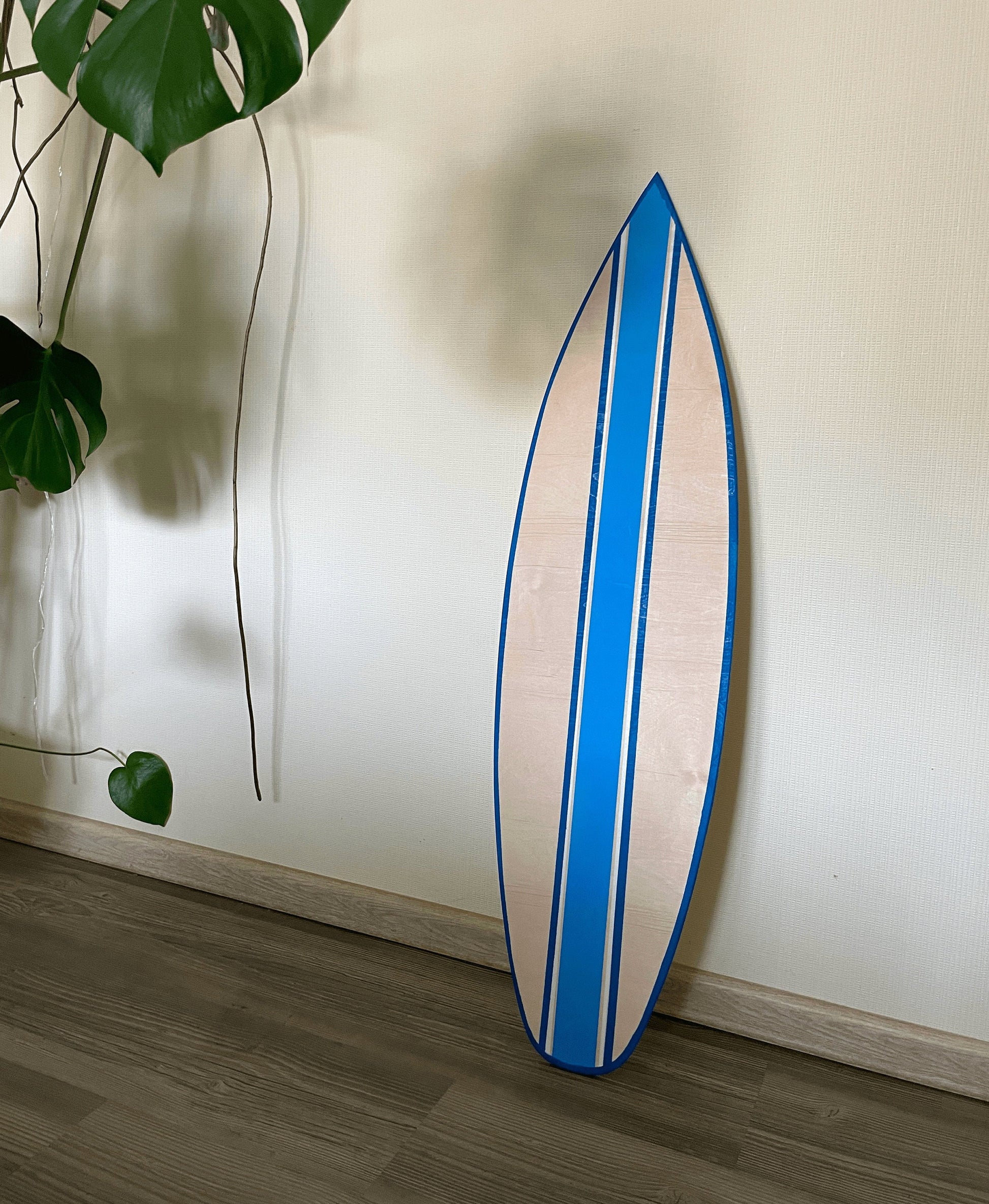 Vibrant hand-painted wooden decorative surfboard, a stunning coastal statement for your space. Artisan craftsmanship meets functional beauty, featuring captivating colors and intricate details. Elevate your decor with this unique, surf-inspired masterpiece