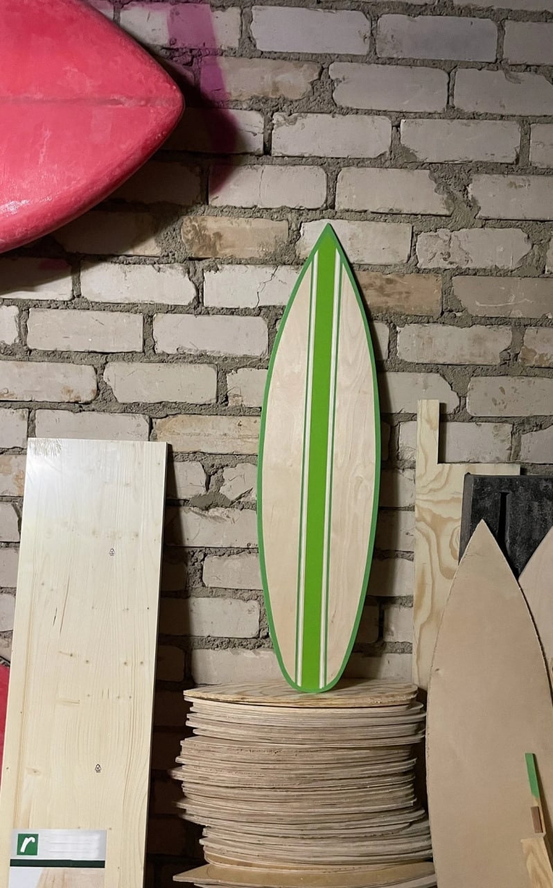 Captivating green hand-painted wooden decorative surfboard, a refreshing coastal statement for your space. Artisan craftsmanship meets functional beauty, featuring lush green hues and intricate details. Elevate your decor with this unique, surf-inspired masterpiece