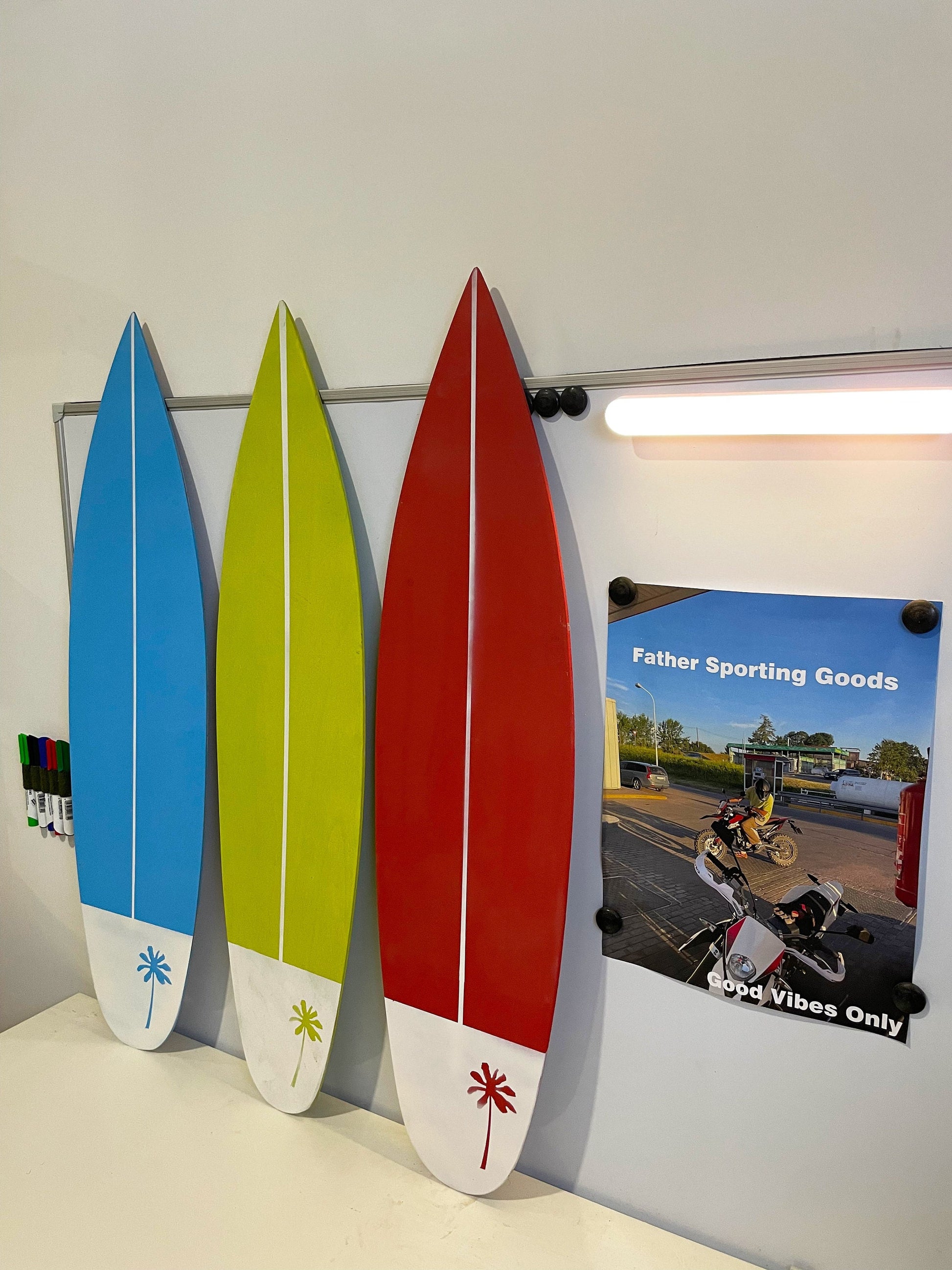 Brighten up your decor with this set of colorful wooden surfboards