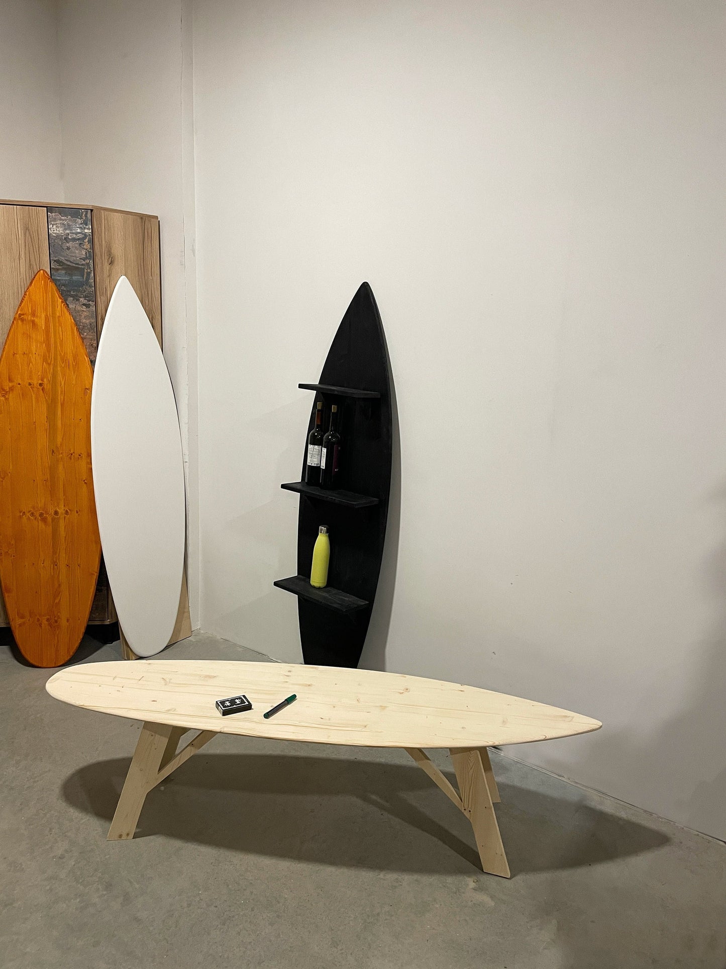 Stussy playing cards on surfboard coffee table 