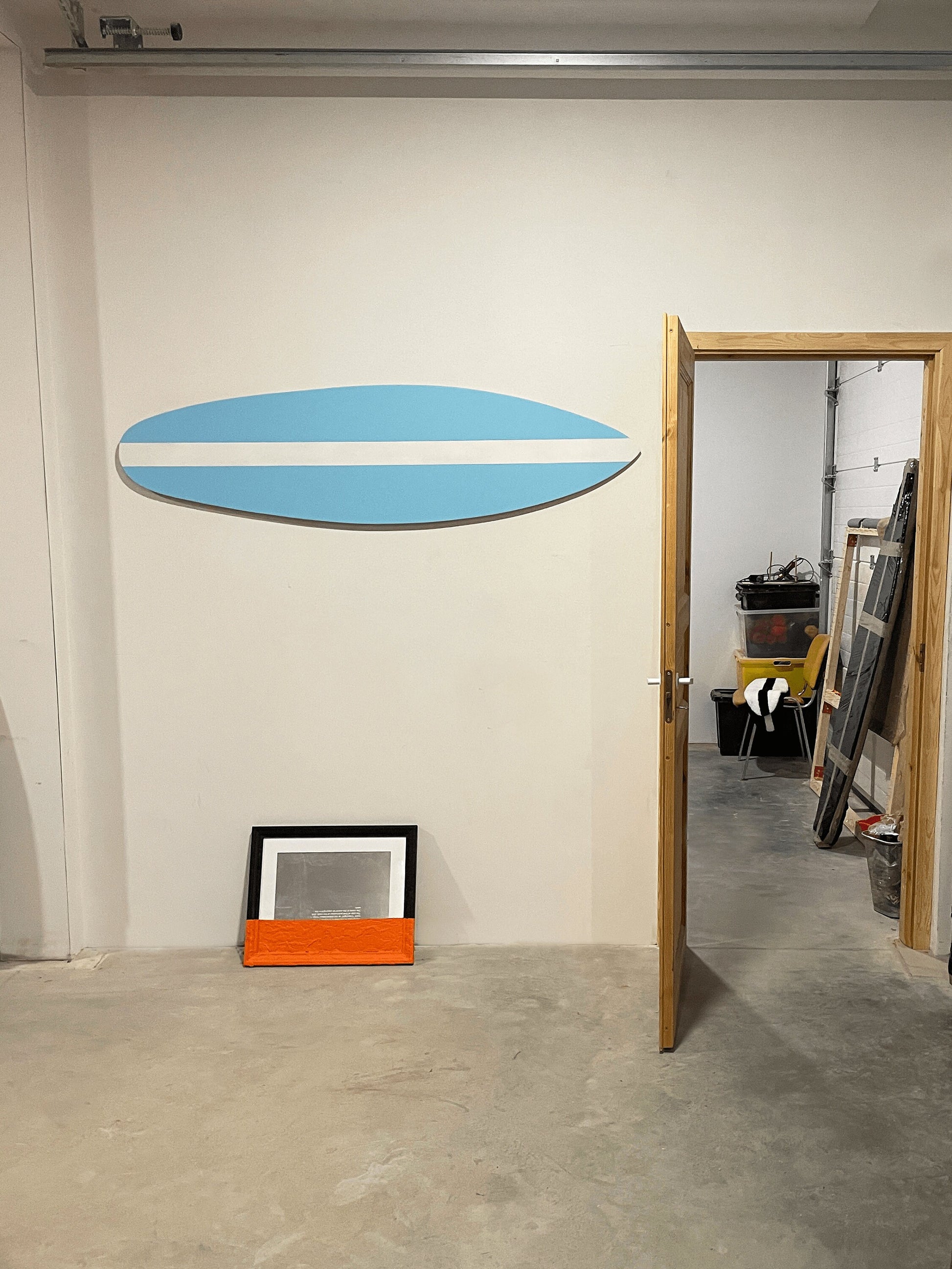 "Baby blue decorative surfboard, a serene coastal accent for your space."