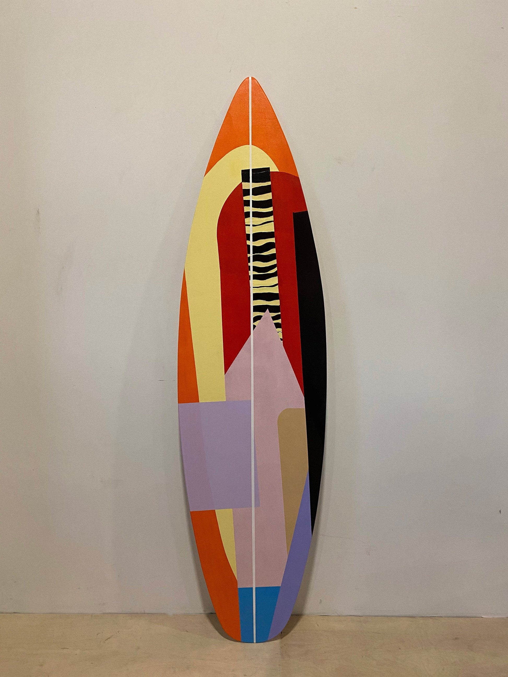 Contemporary vibes: A set of abstract wooden surfboards for chic living