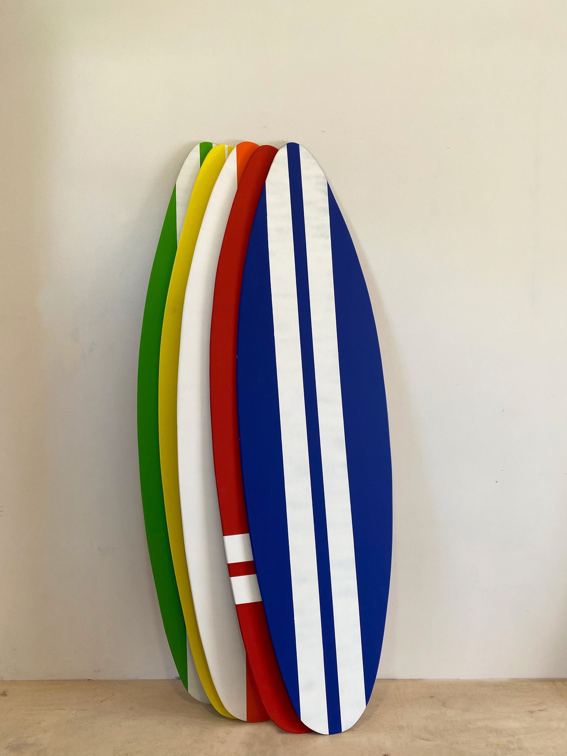 Splash of hues: Wooden surfboard set to elevate your space