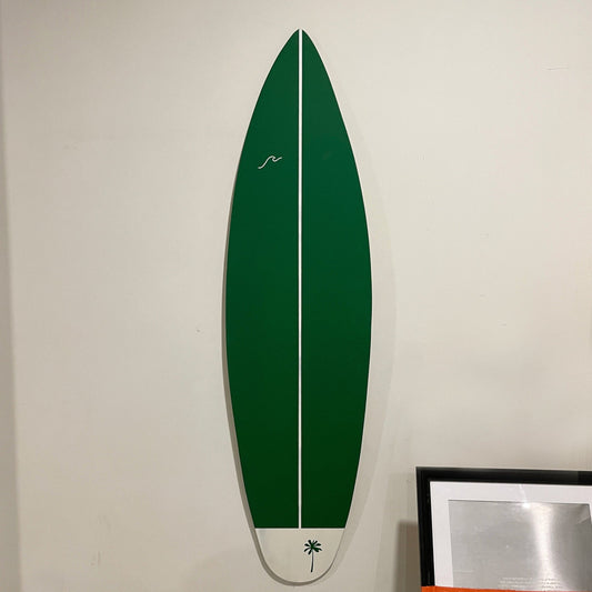 Green surfboard decor, a splash of coastal charm for your space.