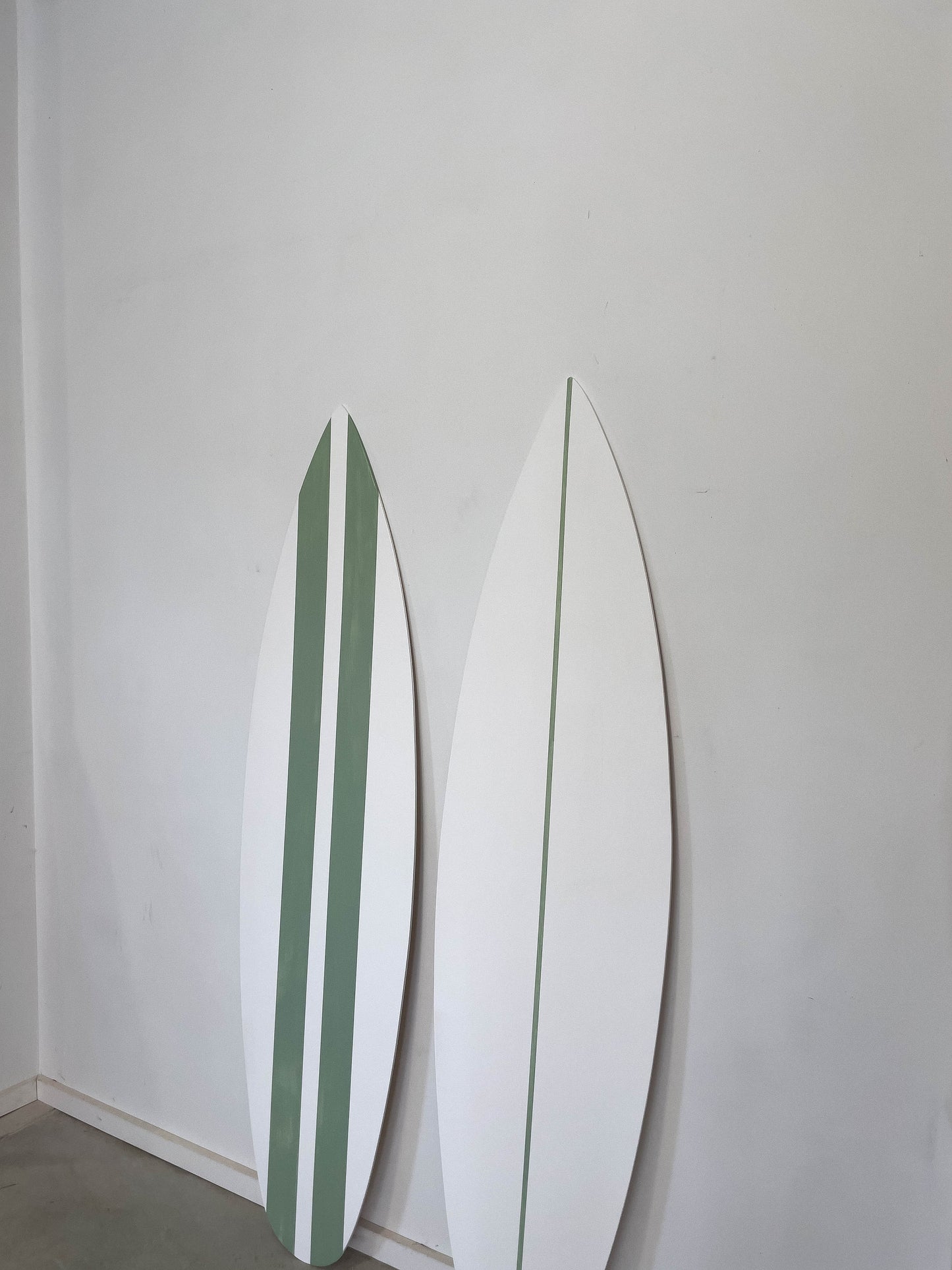 Coastal charm: Chic white mint surfboards to enhance your space