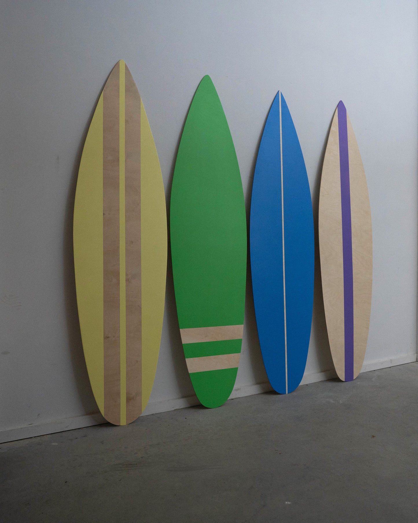 Charm your space with this stylish set of wooden decorative surfboards