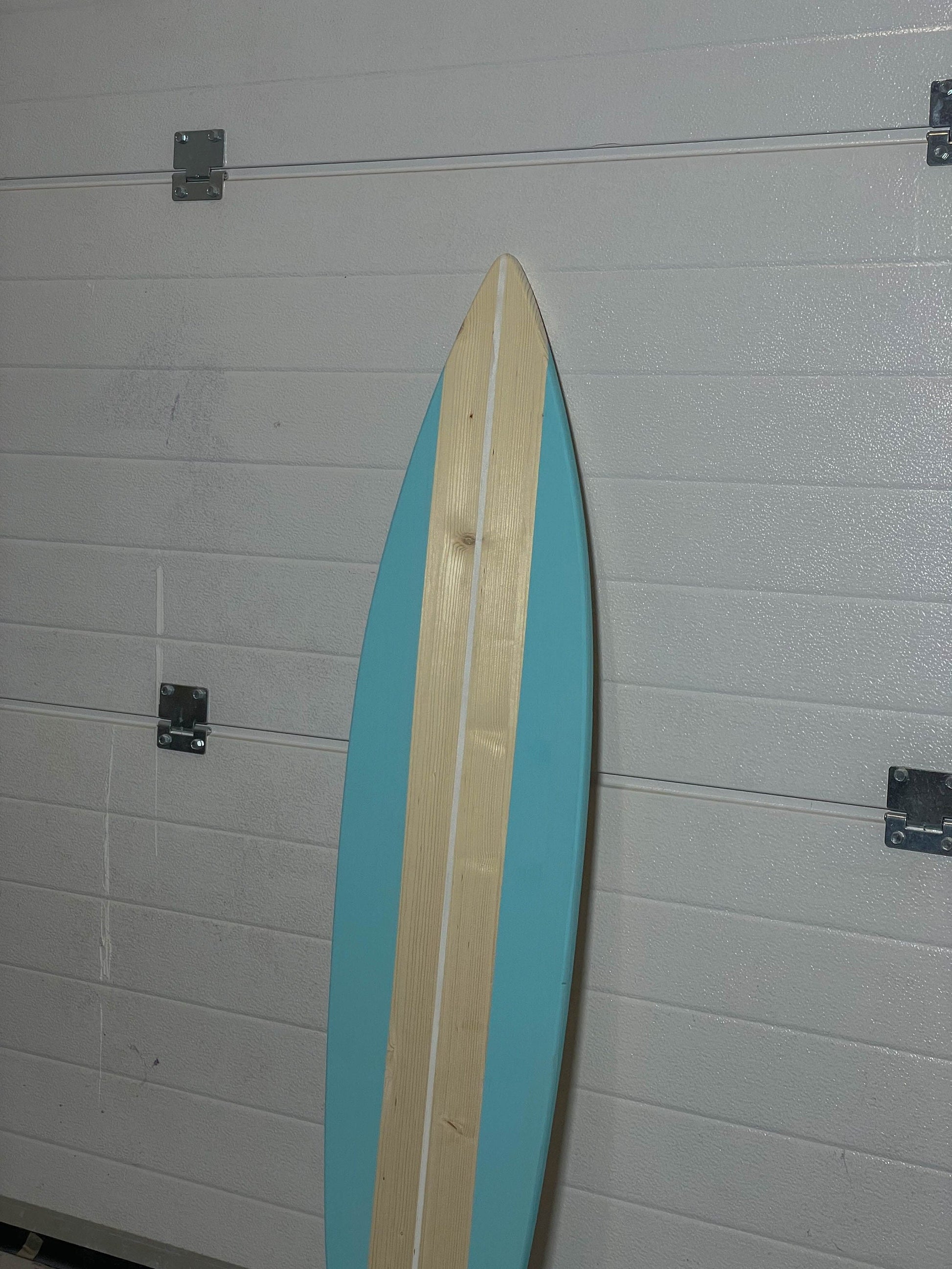 Stylish blue wooden surfboard, a beachy touch for your home