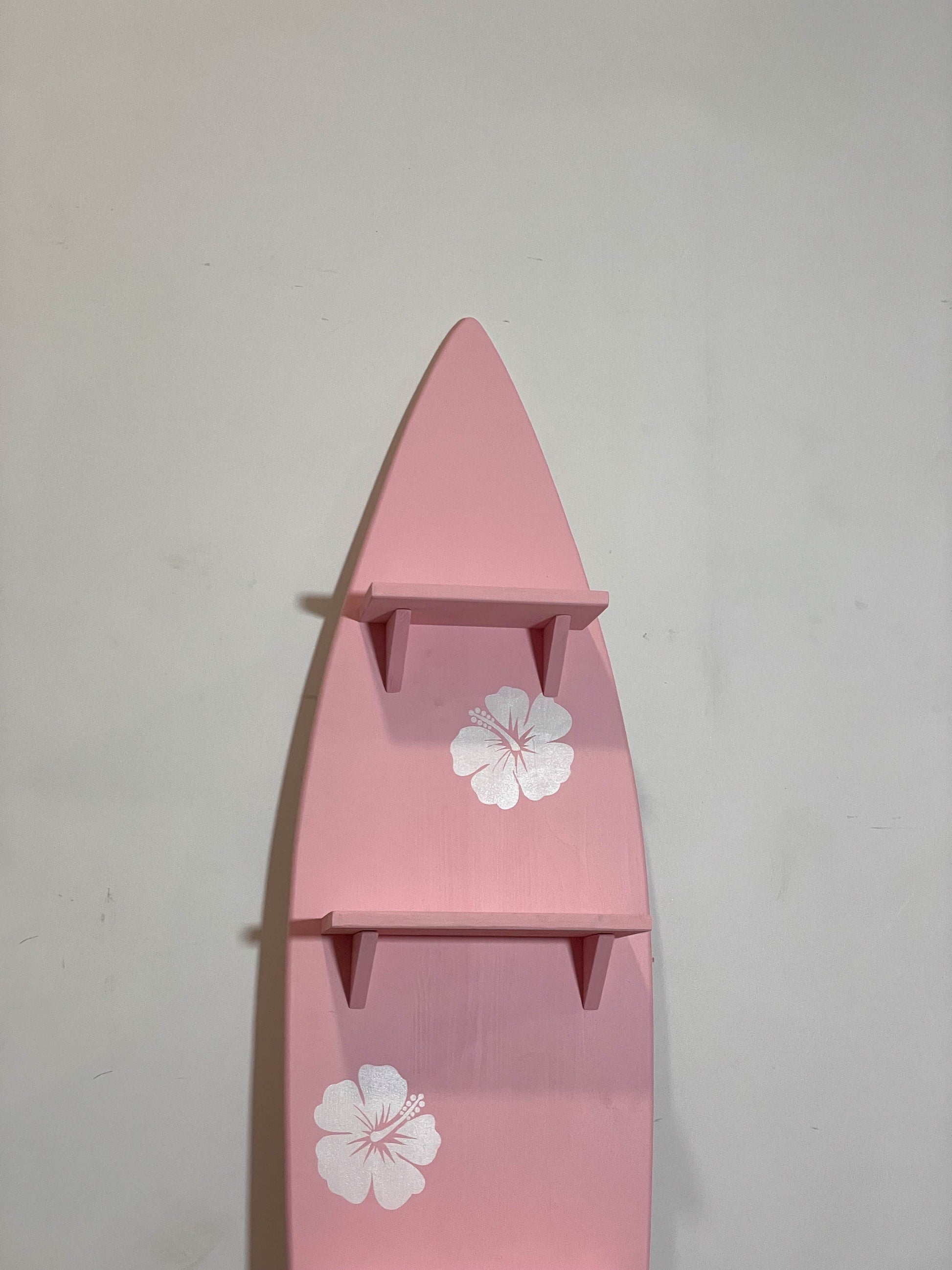 Pink surfboard with shelfs