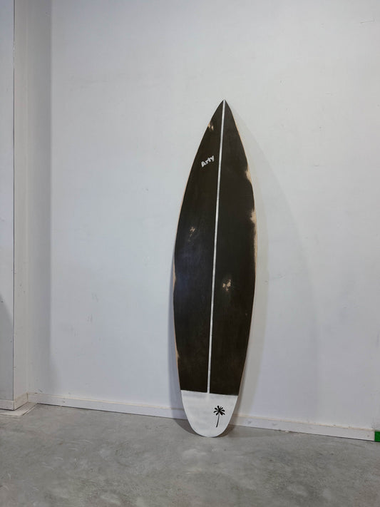 Time-worn elegance: Vintage surfboard in dark olive for chic decor