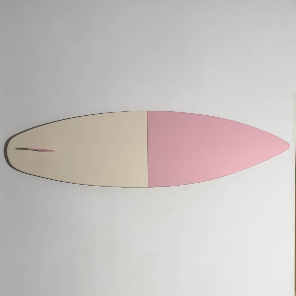 Boho bliss in pink: a chic surfboard for your eclectic decor.